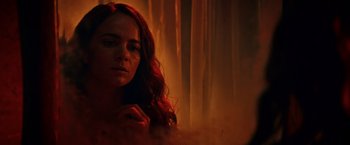 Movie still from “Hypnotic” (2023), directed by Robert Rodriguez – A woman with long red curly hair looking at the camera; Close Up shot, Over the shoulder angle