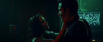 Movie still from “Hypnotic” (2023), directed by Robert Rodriguez – A man and a woman in a dark room touching each other; Close Up shot, Low angle