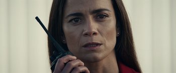 Movie still from “Hypnotic” (2023), directed by Robert Rodriguez – A person holding a cell phone; Close Up shot, Low angle