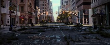 Movie still from “I Am Legend” (2007), directed by Francis Lawrence – An empty city street is shown with no cars on it; Extreme Wide shot, High angle