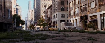Movie still from “I Am Legend” (2007), directed by Francis Lawrence – A street scene with a truck and a van; Extreme Wide shot, High angle