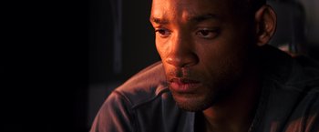 Movie still from “I Am Legend” (2007), directed by Francis Lawrence – A man's face in the dark; Close Up shot, Low angle