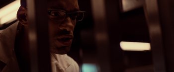 Movie still from “I Am Legend” (2007), directed by Francis Lawrence – A person wearing glasses; Close Up shot, Low angle