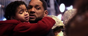 Movie still from “I Am Legend” (2007), directed by Francis Lawrence – A man and a woman hugging each other in the street; Close Up shot, Low angle
