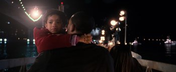 Movie still from “I Am Legend” (2007), directed by Francis Lawrence – A man hugging another man on a street; Medium shot, Over the shoulder angle