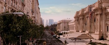 Movie still from “I Am Legend” (2007), directed by Francis Lawrence – An empty city street is shown in the daytime; Extreme Wide shot, High angle