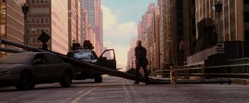 Movie still from “I Am Legend” (2007), directed by Francis Lawrence – A man walking down a street with a cat on a leash; Wide shot, Low angle