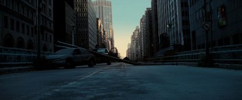 Movie still from “I Am Legend” (2007), directed by Francis Lawrence – A street scene with a car driving down the street; Extreme Wide shot, High angle