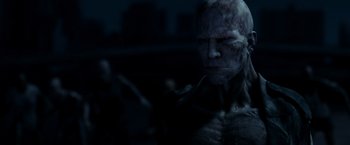 Movie still from “I Am Legend” (2007), directed by Francis Lawrence – A person with a face mask on; Close Up shot, Low angle