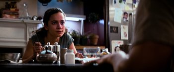 Movie still from “I Am Legend” (2007), directed by Francis Lawrence – A woman sitting at a table in front of a mirror; Close Up shot, Over the shoulder angle