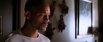 Movie still from “I Am Legend” (2007), directed by Francis Lawrence – A person looking to his left; Close Up shot, Low angle