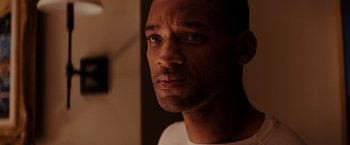 Movie still from “I Am Legend” (2007), directed by Francis Lawrence – A man's face in the dark; Close Up shot, Over the shoulder angle