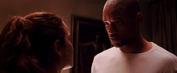 Movie still from “I Am Legend” (2007), directed by Francis Lawrence – A man and a woman looking at each other; Close Up shot, Over the shoulder angle