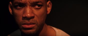 Movie still from “I Am Legend” (2007), directed by Francis Lawrence – A man's face in the dark; Close Up shot, High angle