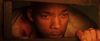Movie still from “I Am Legend” (2007), directed by Francis Lawrence – A man's face looking into a mirror; Extreme Close Up shot, Overhead angle
