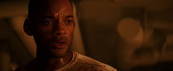 Movie still from “I Am Legend” (2007), directed by Francis Lawrence – A person with blood all over his face; Close Up shot, High angle