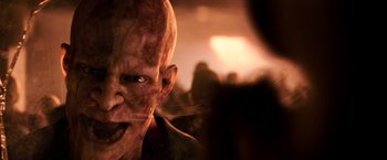Movie still from “I Am Legend” (2007), directed by Francis Lawrence – The face of an evil looking man; Extreme Close Up shot, Low angle
