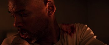 Movie still from “I Am Legend” (2007), directed by Francis Lawrence – A person's face with blood on it; Extreme Close Up shot, Low angle