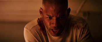 Movie still from “I Am Legend” (2007), directed by Francis Lawrence – A person with blood on his face; Close Up shot, Low angle