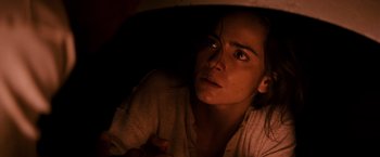 Movie still from “I Am Legend” (2007), directed by Francis Lawrence – A young woman is looking up at the ceiling; Close Up shot, High angle