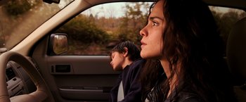 Movie still from “I Am Legend” (2007), directed by Francis Lawrence – A woman and a boy sitting in a car looking out the window; Close Up shot, Over the shoulder angle