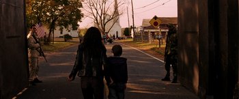 Movie still from “I Am Legend” (2007), directed by Francis Lawrence – A woman and a child walking down a street; Wide shot, Over the shoulder angle