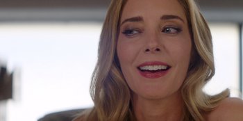 Movie still from “I Believe in Santa” (2022), directed by Alex Ranarivelo – A woman's face with long blonde hair; Close Up shot, Over the shoulder angle