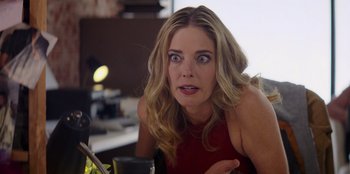 Movie still from “I Believe in Santa” (2022), directed by Alex Ranarivelo – A woman with a surprised look on her face; Close Up shot, Over the shoulder angle