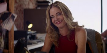 Movie still from “I Believe in Santa” (2022), directed by Alex Ranarivelo – A beautiful blonde woman in a red dress; Close Up shot, Over the shoulder angle