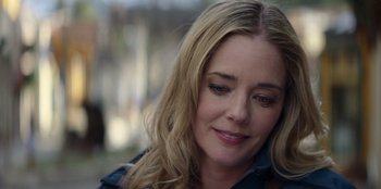 Movie still from “I Believe in Santa” (2022), directed by Alex Ranarivelo – A person with long blonde hair; Close Up shot, Over the shoulder angle