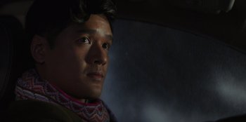 Movie still from “I Believe in Santa” (2022), directed by Alex Ranarivelo – A person with a umbrella; Close Up shot, Low angle