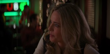 Movie still from “I Believe in Santa” (2022), directed by Alex Ranarivelo – A person sitting in a room; Close Up shot, Over the shoulder angle