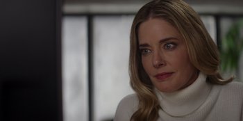 Movie still from “I Believe in Santa” (2022), directed by Alex Ranarivelo – A person wearing a white sweater; Close Up shot, Over the shoulder angle