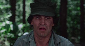 Movie still from “I Spit on Your Grave” (1978), directed by Meir Zarchi – A person wearing a hat; Close Up shot, Low angle