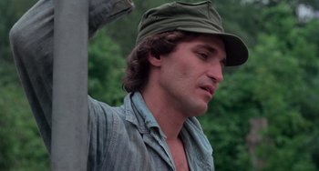 Movie still from “I Spit on Your Grave” (1978), directed by Meir Zarchi – A person wearing a hat; Close Up shot, Low angle