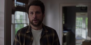 Movie still from “I Want You Back” (2022), directed by Jason Orley – A person wearing a shirt; Close Up shot, Over the shoulder angle
