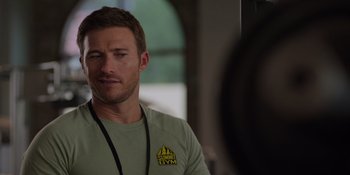 Movie still from “I Want You Back” (2022), directed by Jason Orley – A person wearing a green shirt; Close Up shot, Over the shoulder angle