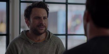 Movie still from “I Want You Back” (2022), directed by Jason Orley – A person wearing a hoodie; Close Up shot, Over the shoulder angle