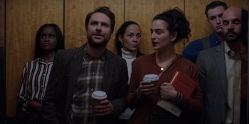 Movie still from “I Want You Back” (2022), directed by Jason Orley – A man and a woman are holding cups of coffee; Medium shot, Over the shoulder angle