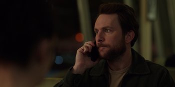 Movie still from “I Want You Back” (2022), directed by Jason Orley – A person talking on a cell phone; Close Up shot, Over the shoulder angle