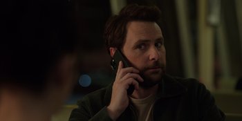 Movie still from “I Want You Back” (2022), directed by Jason Orley – A person talking on a cell phone; Close Up shot, Over the shoulder angle