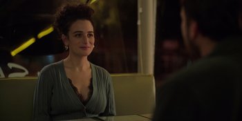 Movie still from “I Want You Back” (2022), directed by Jason Orley – A woman sitting at a table in front of a man; Close Up shot, Over the shoulder angle