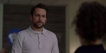 Movie still from “I Want You Back” (2022), directed by Jason Orley – A person wearing a white shirt; Close Up shot, Over the shoulder angle