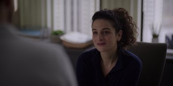 Movie still from “I Want You Back” (2022), directed by Jason Orley – A woman sitting in front of a mirror in a room; Close Up shot, Over the shoulder angle