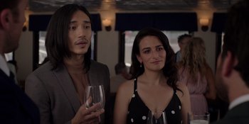 Movie still from “I Want You Back” (2022), directed by Jason Orley – A man and a woman standing next to each other holding a wine glass; Close Up shot, Over the shoulder angle