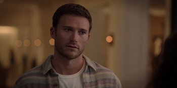 Movie still from “I Want You Back” (2022), directed by Jason Orley – A person wearing a shirt; Close Up shot, Over the shoulder angle