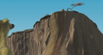 Movie still from “Ice Age” (2002), directed by Chris Wedge – A tree on top of a cliff in the middle of the day; Extreme Wide shot, Low angle