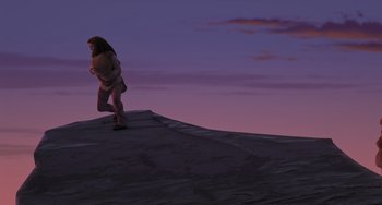Movie still from “Ice Age” (2002), directed by Chris Wedge – A woman walking on top of a hill at dusk; Extreme Wide shot, Low angle
