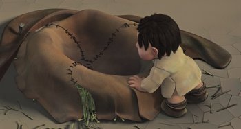 Movie still from “Ice Age” (2002), directed by Chris Wedge – An animated boy is sitting on a blanket; Wide shot, High angle
