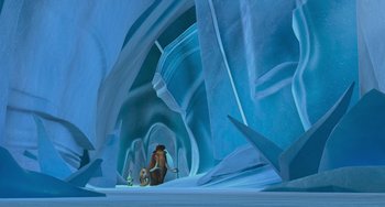 Movie still from “Ice Age” (2002), directed by Chris Wedge – A man kneeling down in the middle of an ice cave; Extreme Wide shot, High angle